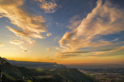 Scenic view of landscape against sky during sunset