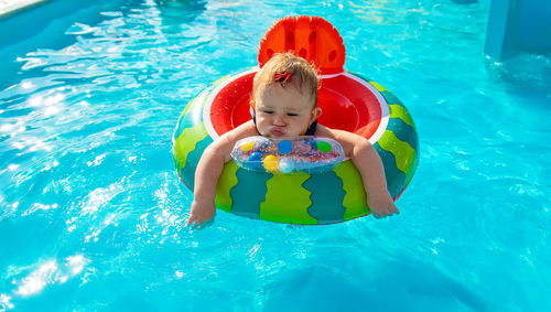 High angle view of boy swimming in pool