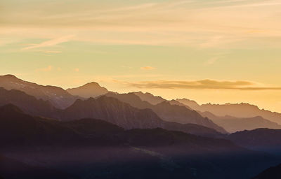 Scenic view of mountains against sky during sunset