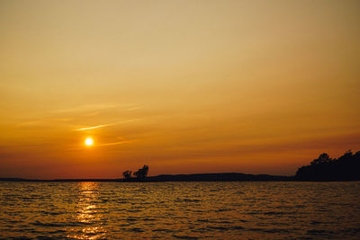 Scenic view of sea against sky during sunset