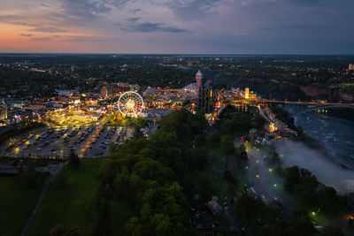 High angle view of illuminated buildings in city