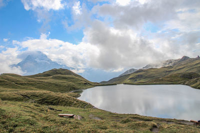 Calm lake along countryside landscape