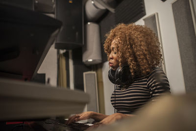 Musician working in a recording studio