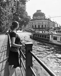 Full length of woman sitting on boat in river