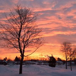 Scenic view of snow covered landscape at dusk