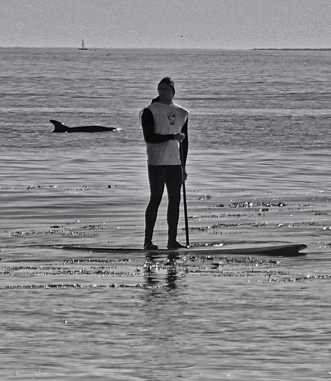 MAN STANDING ON BEACH