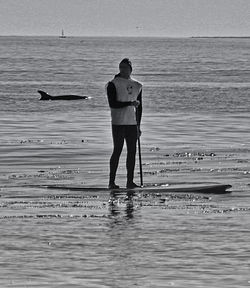 Full length of man standing on beach