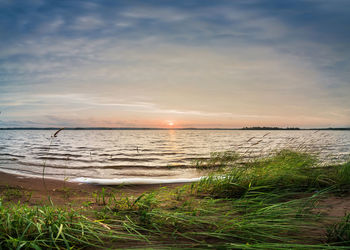 Scenic view of sea against sky during sunset