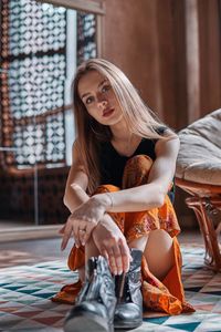 Young woman sitting in traditional clothing
