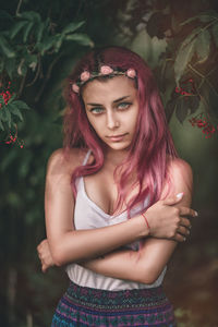 Portrait of beautiful young woman standing outdoors