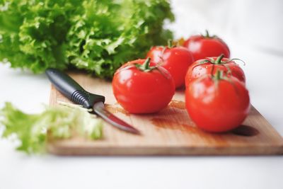 Close-up of tomatoes on cutting board