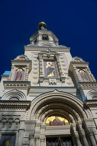 Low angle view of building against blue sky