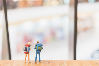 Close-up of figurines on wooden table