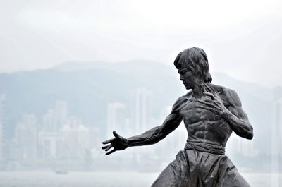 Low angle view of statue against sky