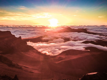 Scenic view of mountains against sky during sunset