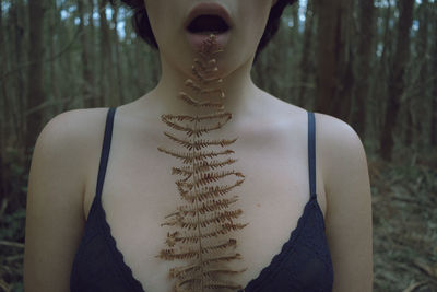 Midsection of woman in a forest