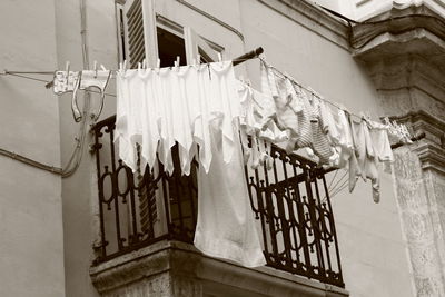 Low angle view of clothes drying outside house