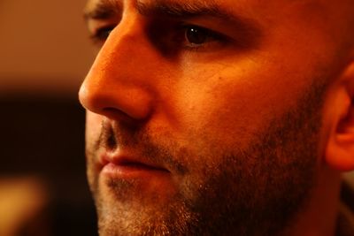 Close-up portrait of young man looking away