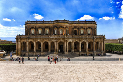 Tourists in front of historical building