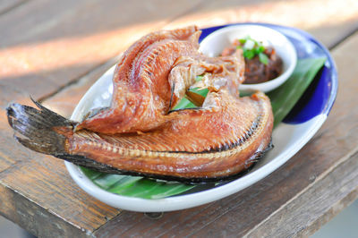 High angle view of fish in plate on table