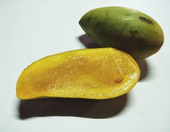 High angle view of lemon slice over white background