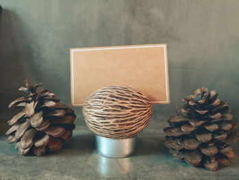 Close-up of pine cone on table