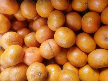 Full frame shot of oranges at market stall