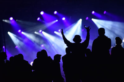 Silhouette people enjoying at music concert