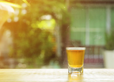 Close-up of beer glass on table