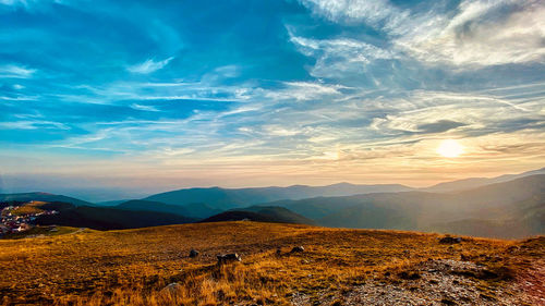 Scenic view of landscape against sky during sunset