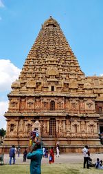 Low angle view of temple in city against sky