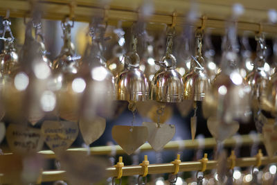 Close-up of decorations hanging on metal for sale
