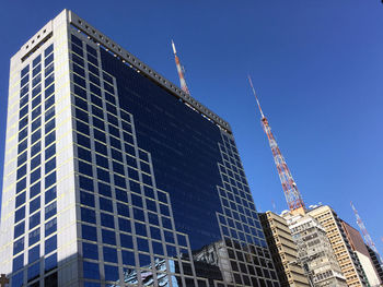 Low angle view of modern building against clear sky