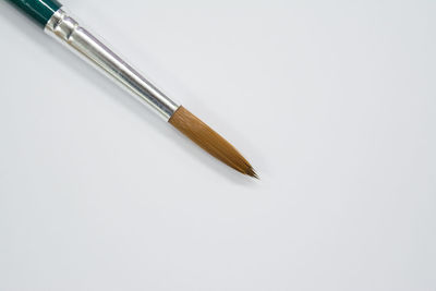 High angle view of pencils against white background