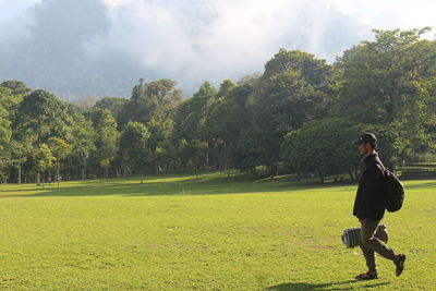 Full length of woman on field against sky