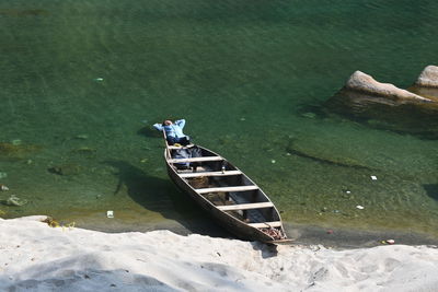 High angle view of boat moored on lake