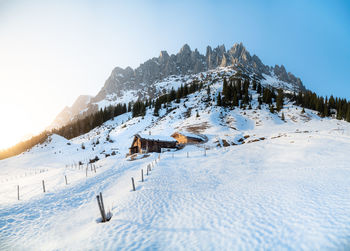 Scenic view of snow covered mountains against sky