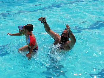Children playing in swimming pool