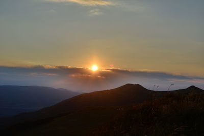 Scenic view of mountains against sky during sunset