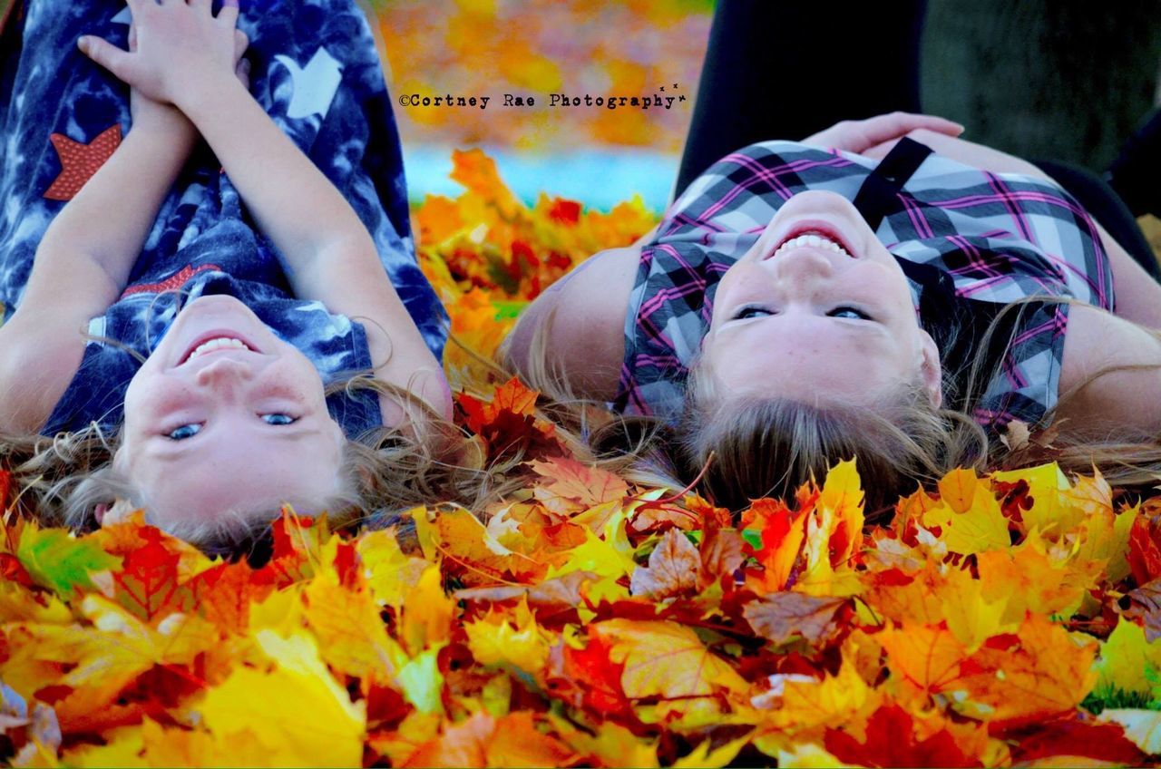 looking at camera, portrait, togetherness, animal themes, person, happiness, smiling, front view, lifestyles, leisure activity, bonding, casual clothing, yellow, flower, costume, cute, love