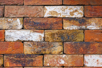 Colorful brownish and white decorative bricks flat wall texture and background