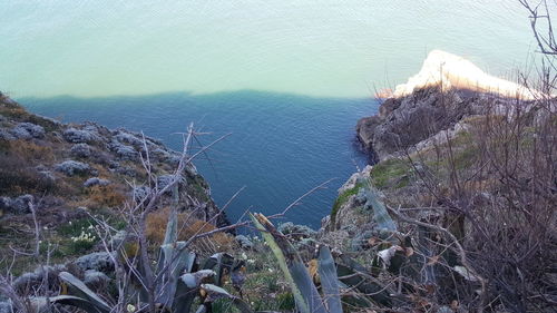 High angle view of sea shore against sky