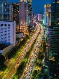 High angle view of illuminated buildings in city