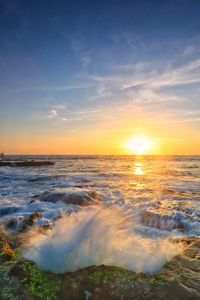 Scenic view of sea against sky during sunset