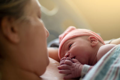 A new baby and mother make eye contact for the first time