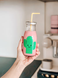 Close-up of woman hand holding drink