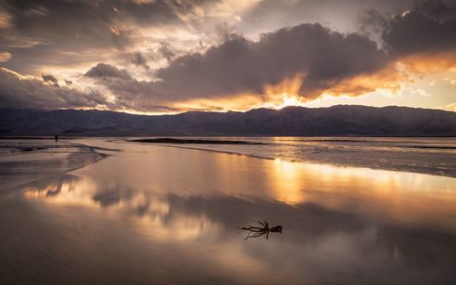 Scenic view of lake against sky during sunset