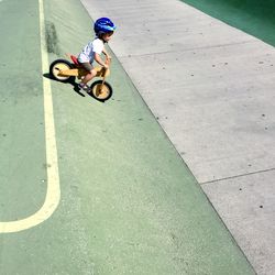 Boy riding bicycle in park