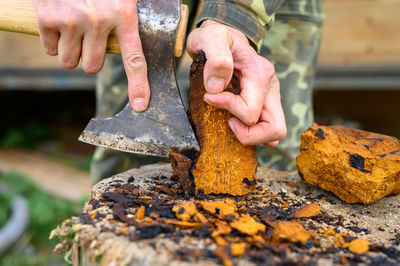 Close-up of man preparing food