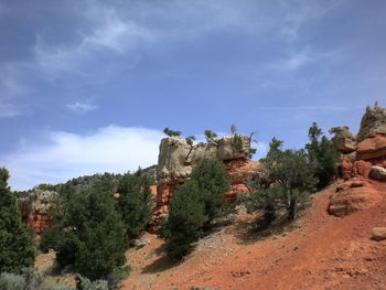 Rock formations on landscape against sky
